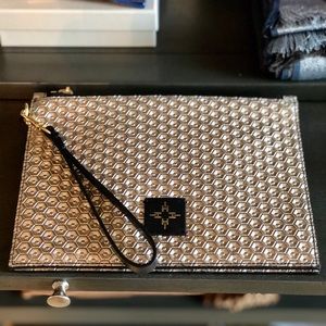 India Hicks gold clutch with leather wristlet